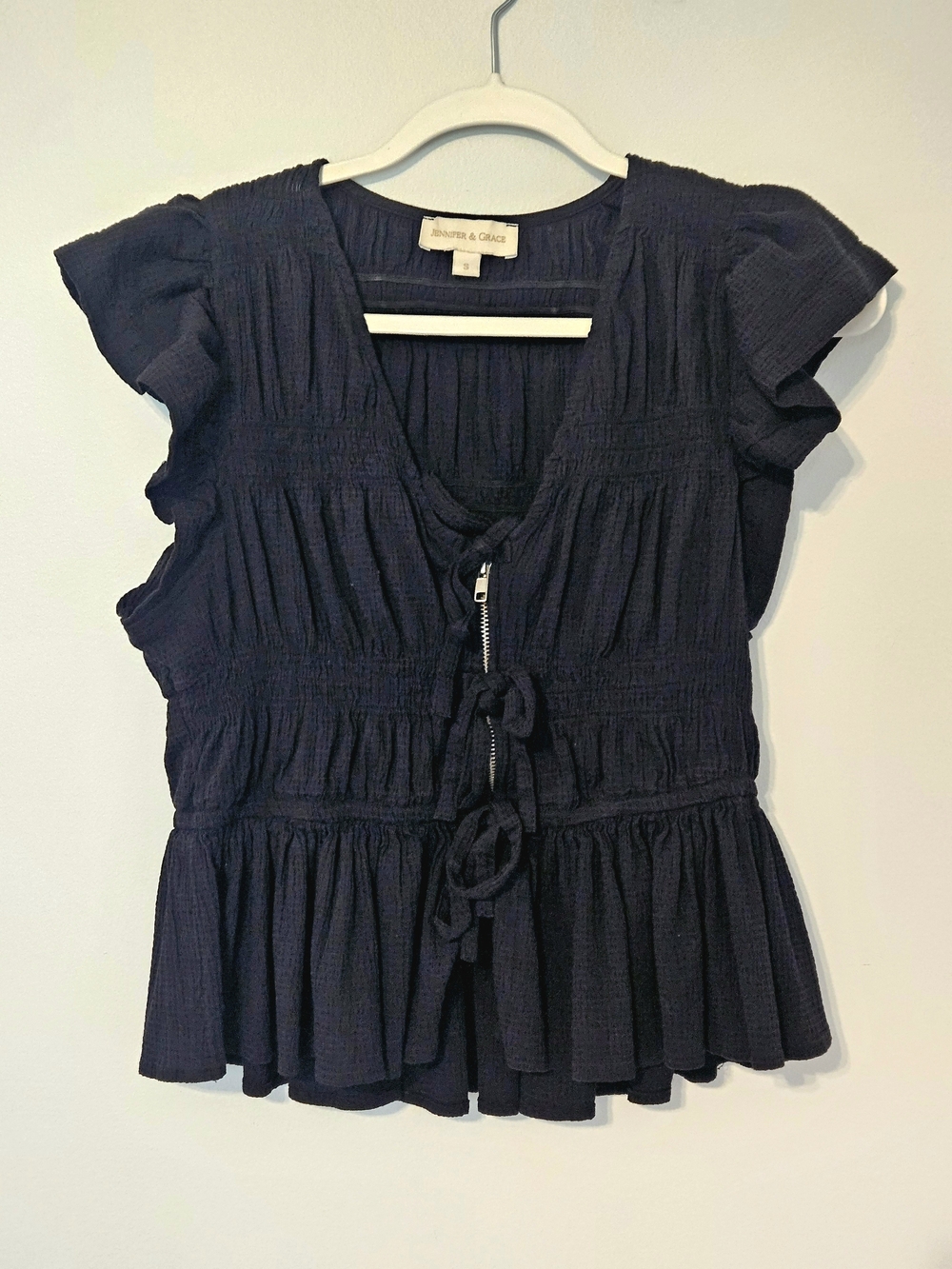 Black Sleeveless Ruffled Zipper And Tie-Front Blouse